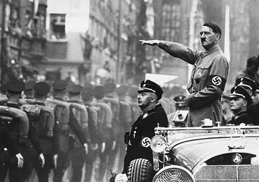 Adolf Hitler salutes his troops