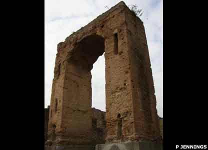 The Arch of Caligula faces the city's main road, the Via della Fortuna
