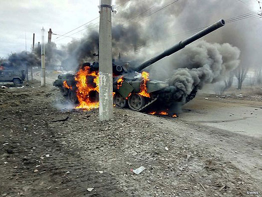 A Russian tank burns in Ukraine in 2022