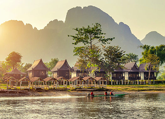 Riverside huts in Laos